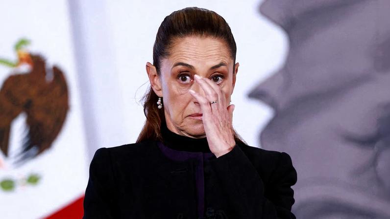Mexico's President Claudia Sheinbaum reacts during a press conference about the wave of violence in Mexico
