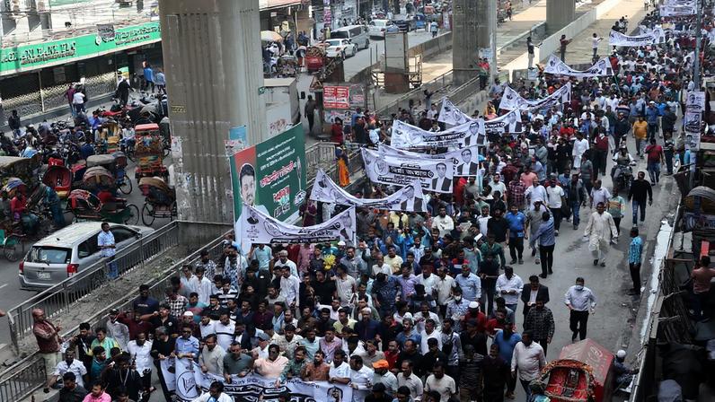Supporters of Bangladesh Nationalist Party (BNP) march with banners as they join in an election campaign in Dhaka, Bangladesh, January 28, 2026.