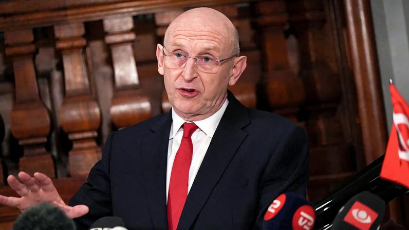 British Defence Secretary John Healey talks to the media in Copenhagen, Denmark, January 21, 2026. REUTERS/Tom Little