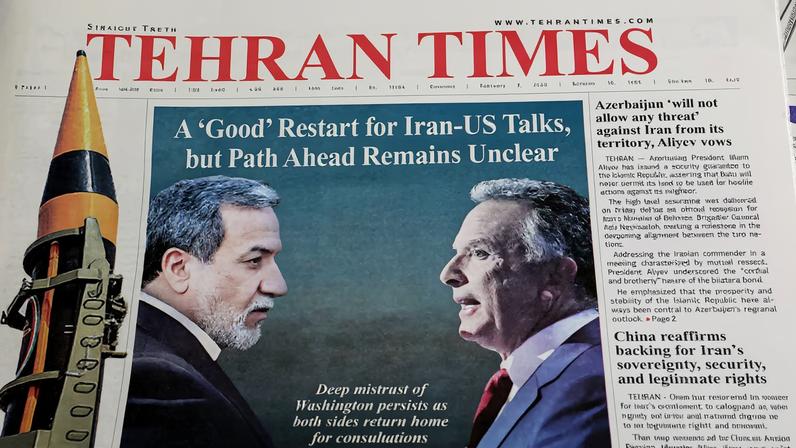 An Iranian newspaper with a cover photo of Iran's Foreign Minister Abbas Araqchi and U.S. Middle East envoy Steve Witkoff, in Tehran