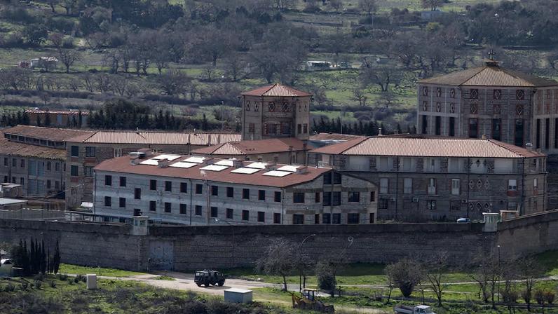 Vehicles stand near the Badu'e Carros prison in Nuoro, Italy, February 1, 2026. REUTERS/Remo Casilli