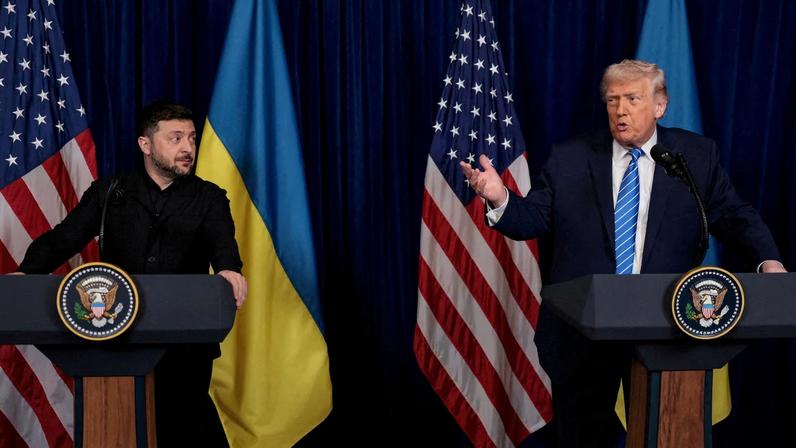 Ukrainian President Volodymyr Zelenskiy listens to U.S. President Donald Trump, after Trump said that Russian President Vladimir Putin expressed willingness to help Ukraine "succeed", during a...