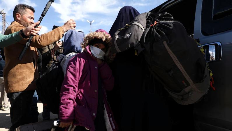 Members of Australian families believed to be linked to the Islamic State militants leave Roj camp near Derik, Syria.