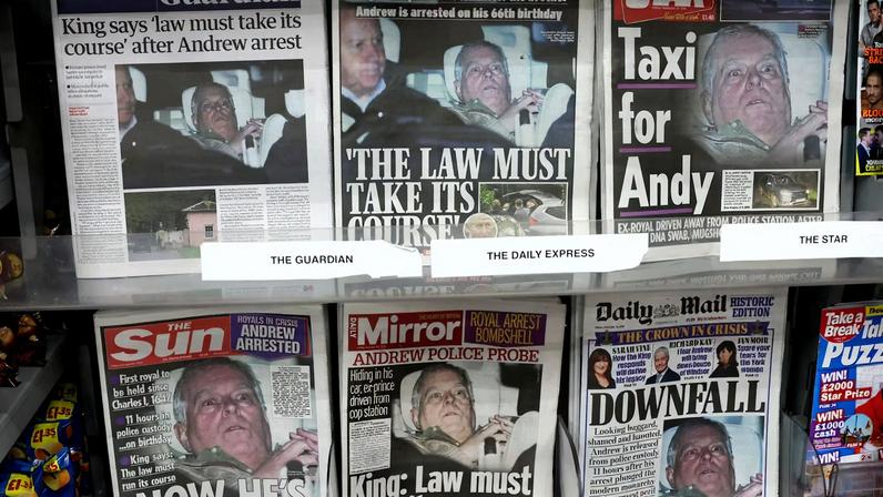 British newspapers, featuring coverage of the arrest of Andrew Mountbatten-Windsor, younger brother of Britain's King Charles, on suspicion of misconduct in public office, sit on display in a newsagent in London, Britain, February 20, 2026.