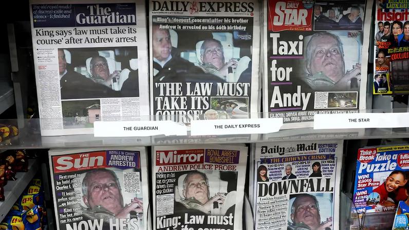 British newspapers, featuring coverage of the arrest of Andrew Mountbatten-Windsor, younger brother of Britain's King Charles, on suspicion of misconduct in public office, sit on display in a newsagent in London