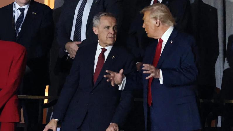 Soccer Football - FIFA World Cup 2026 - FIFA World Cup 2026 Draw - John F. Kennedy Center for the Performing Arts, Washington, D.C., U.S. - December 5, 2025 Canada's Prime Minister Mark Carney and U.S. President Donald Trump during the FIFA World Cup 2026 Draw REUTERS/Jonathan Ernst