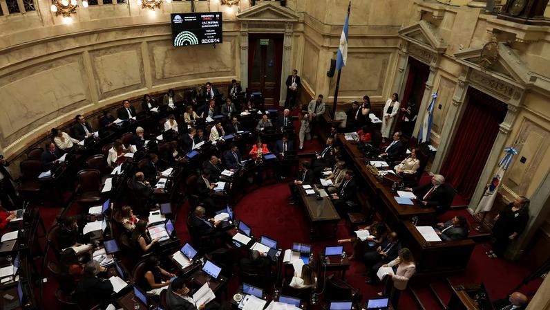 Members of Argentina's Senate attend a session to discuss labor reforms proposed by President Javier Milei's libertarian government to attract investment and revive growth, as unions say it would roll back workers' rights, in Buenos Aires, Argentina February 12, 2026. REUTERS/Cristina Sille