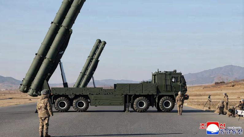 North Korean leader Kim Jong Un directs test of large-caliber multiple-rocket launch system