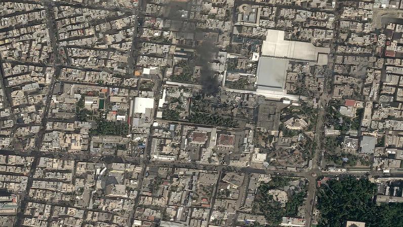 A satellite image shows black smoke rising and heavy damage at Iranian Supreme Leader Ayatollah Ali Khamenei's compound in Tehran