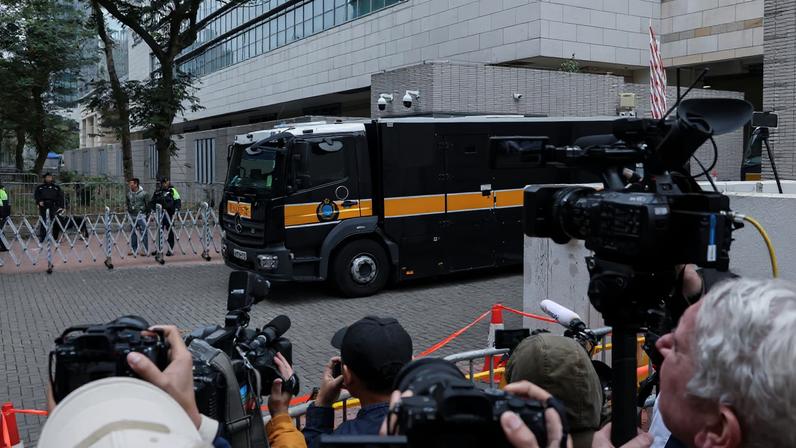 A prison van believed to be carrying Jimmy Lai, founder of the now-defunct pro-democracy newspaper Apple Daily, leaves the West Kowloon Magistrates' Courts building following sentencing in his national security collusion trial, in Hong Kong