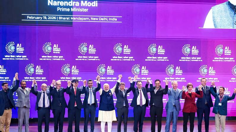 India's Prime Minister Narendra Modi poses for a photograph with Google and Alphabet CEO Sundar Pichai, OpenAI CEO Sam Altman, CEO of Anthropic Dario Amodei, and other global tech leaders at the AI Impact Summit, in New Delhi, India February 19, 2026.India's Press Information Bureau/Handout via REUTERS