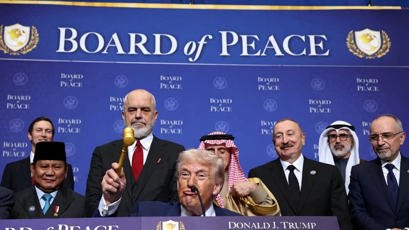 U.S President Donald Trump holds a gavel, during the inaugural Board of Peace meeting at the U.S. Institute of Peace in Washington, D.C., U.S., February 19, 2026. REUTERS/Kevin Lamarque