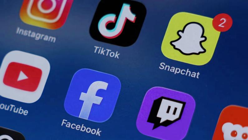 Instagram, TikTok, Snapchat, YouTube, Facebook, Twitch and Reddit applications are displayed on a mobile phone in this picture illustration taken on December 9, 2025.