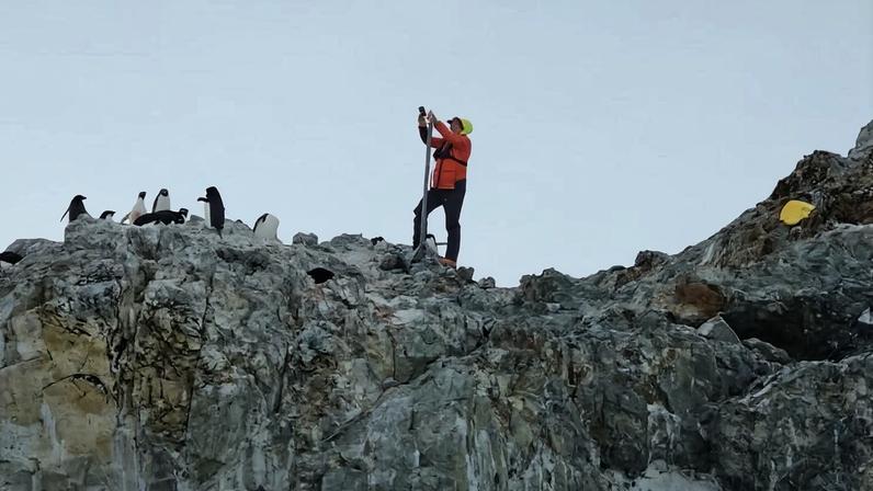 Study co-author Tom Hart changes the batteries on a remote camera. Penguin Watch’s camera network includes more than 77 cameras that monitor penguin colonies year-round, providing a wealth of data.