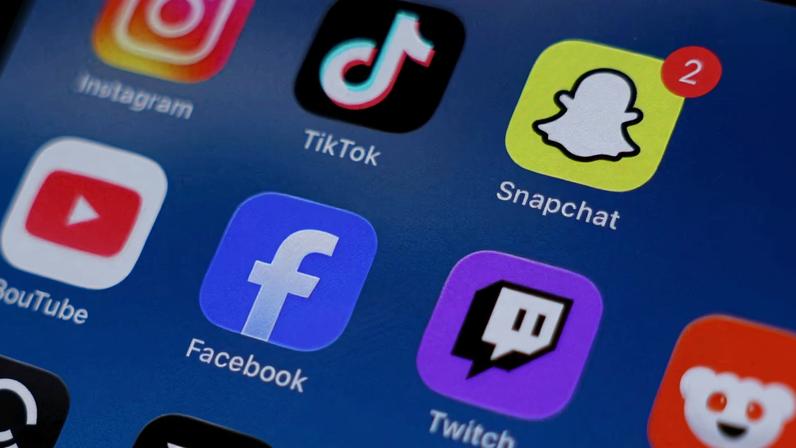 Instagram, TikTok, Snapchat, YouTube, Facebook, Twitch and Reddit applications are displayed on a mobile phone in this picture illustration taken on December 9, 2025.