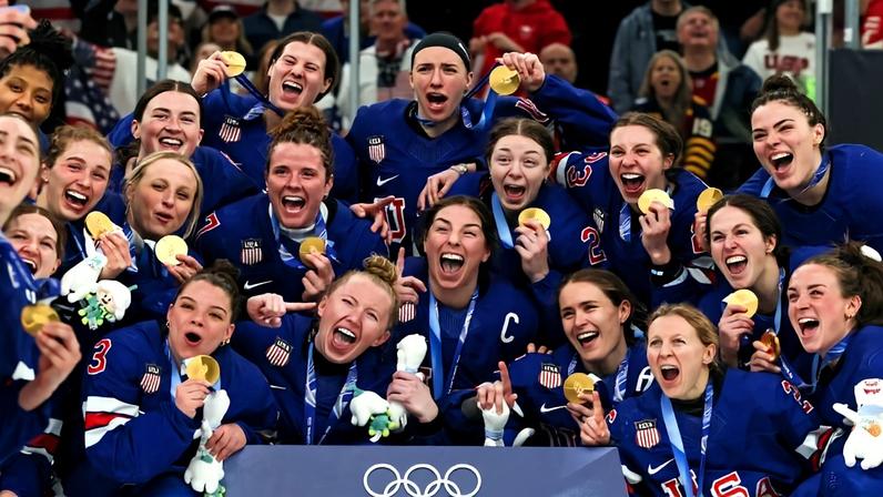 The gold medal-winning U.S. women’s hockey team poses after the medal ceremony following the gold medal match between the United States and Canada at the 2026 Milano Cortina Olympics in Milan.