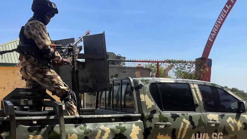 A Nigerian soldier stands on a military truck, during the tour of the Theatre Command Operation Lafiya Dole by Nigeria's Chief of Army Staff, at the Maimalari Cantonment in Maiduguri, Borno, Nigeria, November 7, 2025.