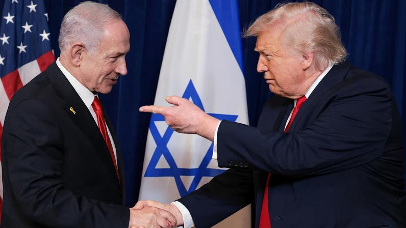 U.S. President Donald Trump points his finger towards Israeli Prime Minister Benjamin Netanyahu as they shake hands during a press conference after meeting at Trump’s Mar-a-Lago club in Palm Beach, Florida, U.S., December 29, 2025.
