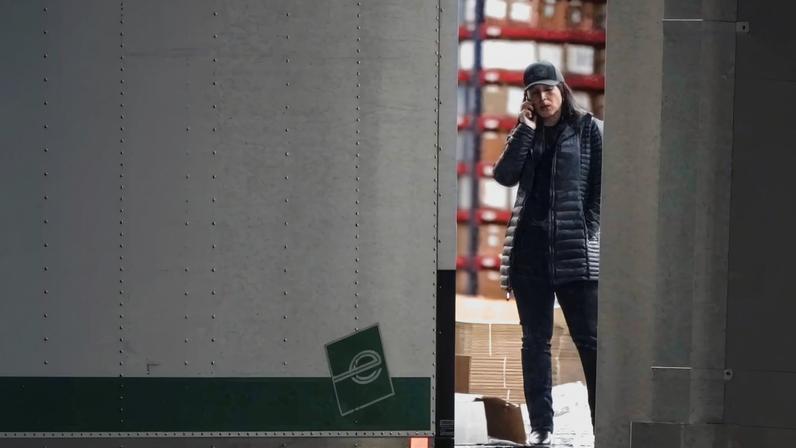 United States Director of National Intelligence Tulsi Gabbard speaks on the phone while standing at the edge of a truck loading bay after the Federal Bureau of Investigation (FBI) executed a search warrant for the Fulton County Election Hub and Operation Center in relation to the 2020 election, according to a law enforcement official familiar with the matter, in Union City, Georgia, U.S. January 28, 2026. REUTERS/Elijah Nouvelage.