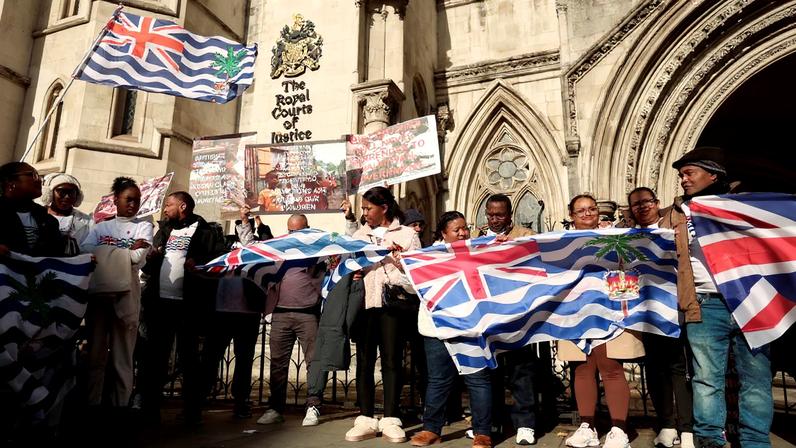 FILE PHOTO: People protest outside the High Court where Chagossian campaigners are challenging the British government's deal to transfer sovereignty of the Chagos Islands to Mauritius, in London, Britain, October 28, 2025.