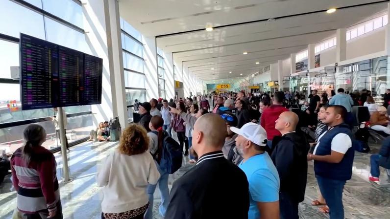 People gather at the Guadalajara International Airport, in Tlajomulco de Zuniga