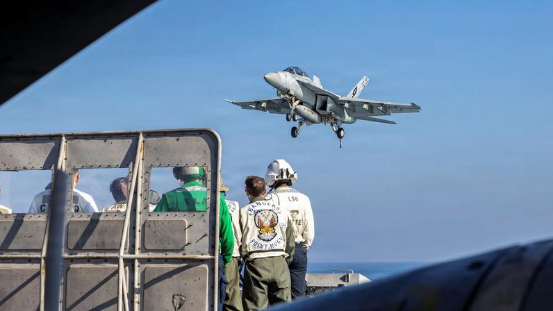 An F/A-18F Super Hornet prepares to make an arrested landing on the flight deck of the U.S. Navy's Nimitz-class aircraft carrier USS Abraham Lincoln (CVN 72) in the Arabian Sea February 15, 2026.