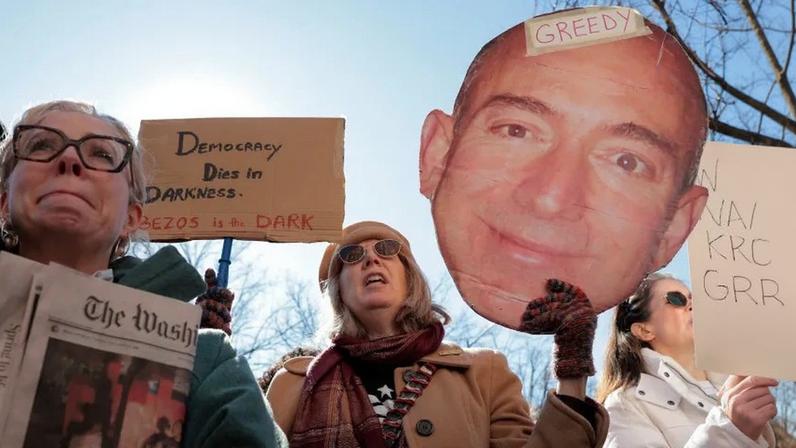 Washington, D.C., residents join members of the guild to protest outside the Washington Post office in Washington on Feb. 5, after the newspaper announced major layoffs.
