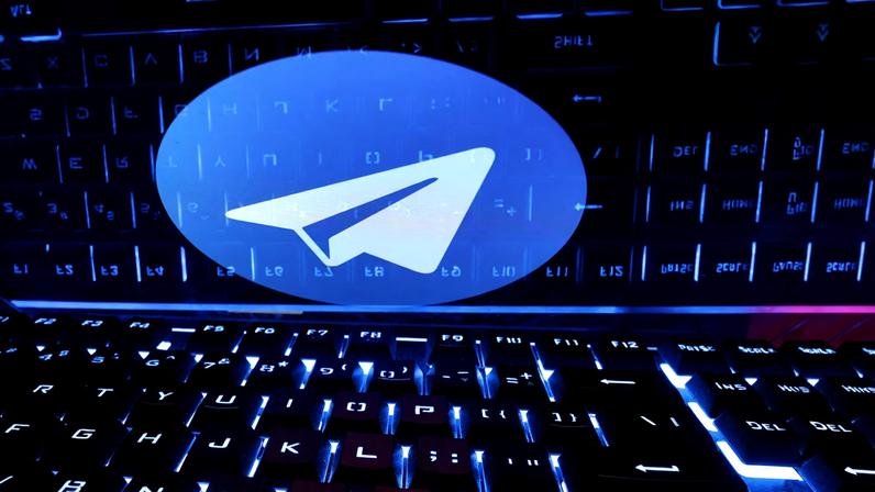 A keyboard is placed in front of a displayed Telegram logo in this illustration taken February 21, 2023. REUTERS/Dado Ruvic/Illustration