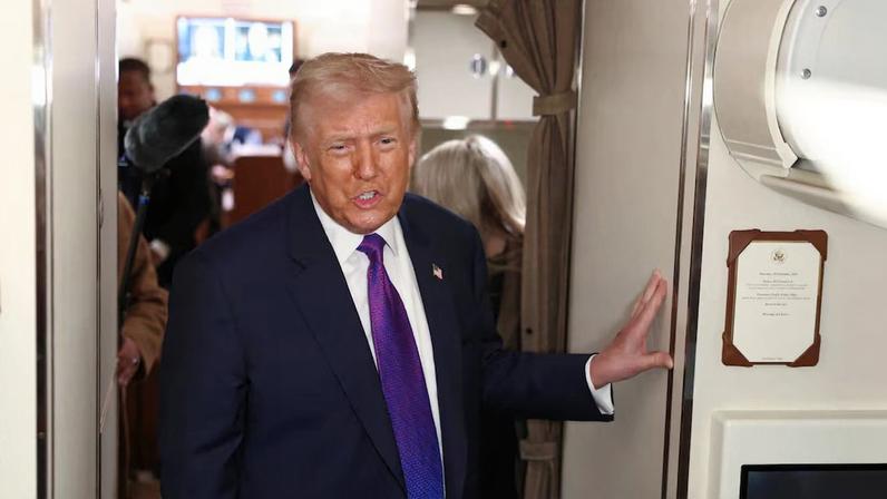 U.S. President Donald Trump speaks to reporters aboard Air Force One, February 19, 2026. REUTERS/Kevin Lamarque
