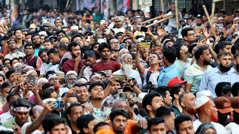 Supporters of the Bangladesh Nationalist Party (BNP) chant slogans, during an election campaign rally attended by the party chairman, Tarique Rahman, ahead of the national election, at Jatrabari, in Dhaka