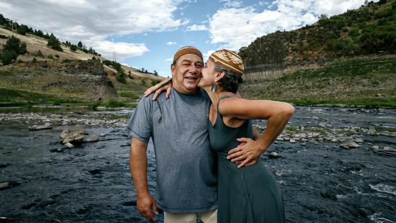 Lisa Morehead-Hillman and Leaf Hillman, both Karuk, celebrate the removal of the dams on the newly exposed reservoir floor in 2024. The former head of the Karuk Natural Resources Department, Leaf spent two decades working with other Indigenous groups, environmental organizations and government officials to bring back the Klamath River. Image courtesy of Kiliii Yüyan.