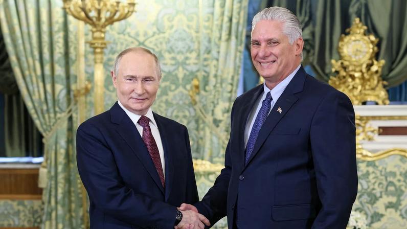 Russian President Vladimir Putin shakes hands with Cuban President Miguel Diaz-Canel during a meeting at the Kremlin in Moscow, Russia, May 7, 2025. Sputnik/Mikhail Metzel/Pool via REUTERS