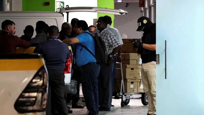 Members of Panama’s investigative police conduct a search at offices tied to the Panama Ports Company, the local unit of Hong Kong conglomerate CK Hutchison, and load boxes into a truck in an underground parking area in the upscale Albrook district of Panama City, Panama, February 26, 2026. REUTERS/Aris Martinez