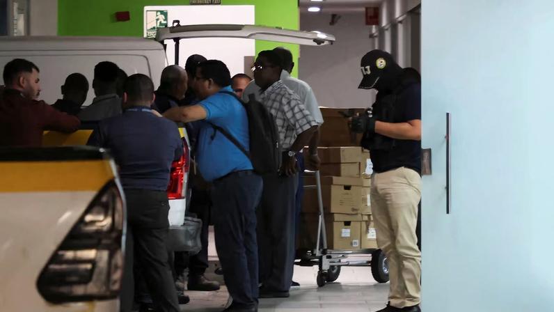 Members of Panama’s investigative police conduct a search at offices tied to the Panama Ports Company, the local unit of Hong Kong conglomerate CK Hutchison, and load boxes into a truck in an underground parking area in the upscale Albrook district of Panama City, Panama, February 26, 2026. REUTERS/Aris Martinez