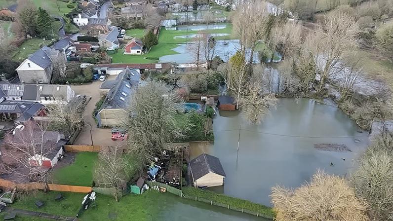 The River Cerne burst its banks during Storm Chandra