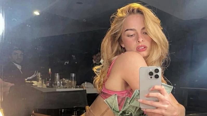 The price is right: Addison Rae changed into a latex dress covered in fake money.