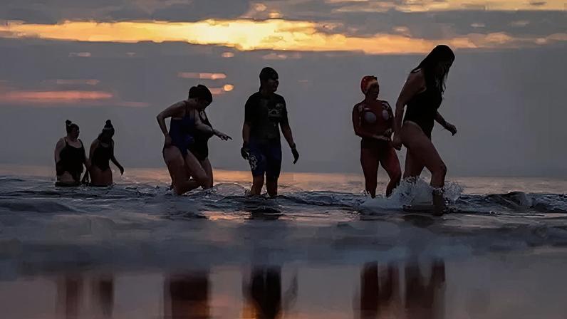 Female swimmers take part in an International Woman's day swim