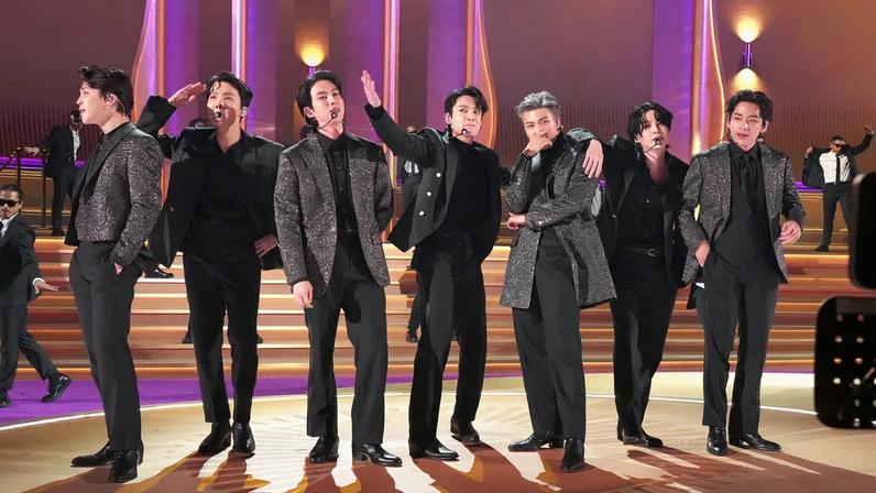 LAS VEGAS, NEVADA - APRIL 03: (L-R) Jimin, J-Hope, Jin, Jungkook, RM, Suga, and V of BTS perform onstage during the 64th Annual GRAMMY Awards at MGM Grand Garden Arena on April 03, 2022 in Las Vegas, Nevada.