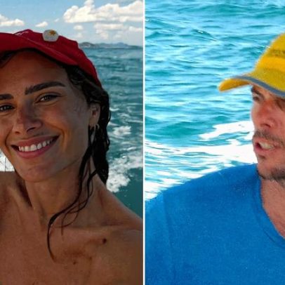 Carolina Dieckmann e o marido passeiam de barco pelo rio