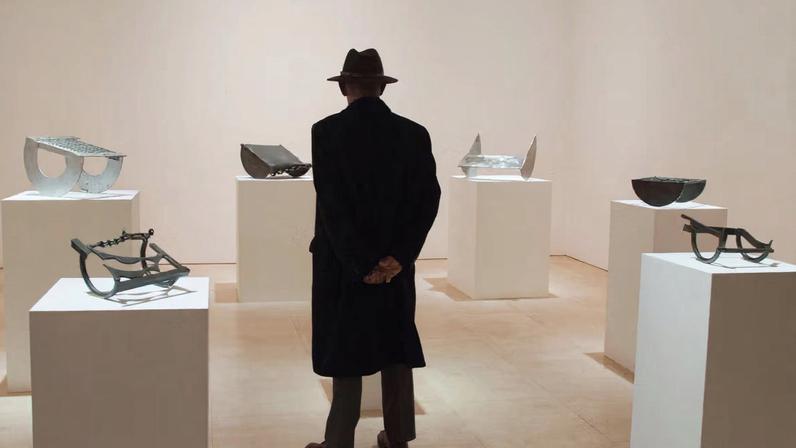 A visitor at the Melvin Edwards solo exhibition at Stephen Friedman’s London space, in 2024
