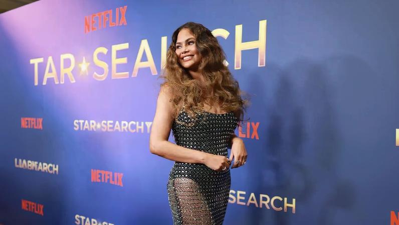 Chrissy Teigen hit the red carpet in a totally sheer gown on Tuesday.