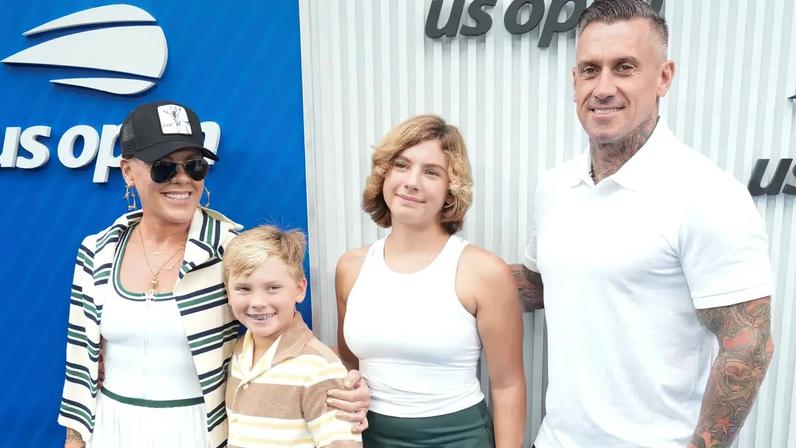 Pink, Carey Hart, Jameson Moon Hart, and Willow Sage Hart pose for a photo.