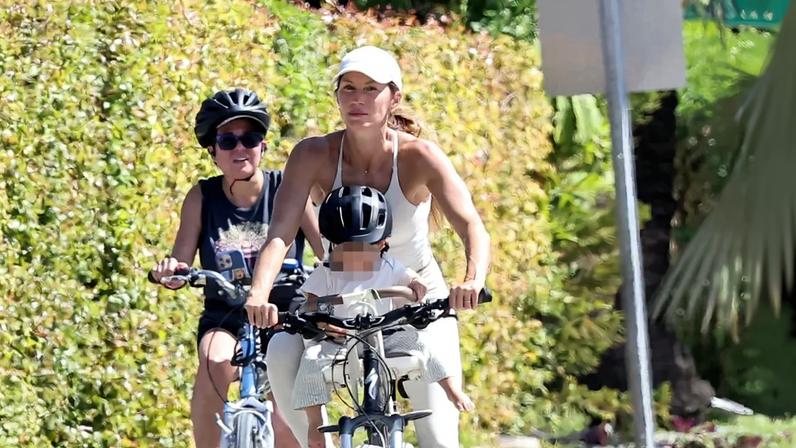 Gisele Bündchen took a bike ride with her baby son Saturday in Miami.