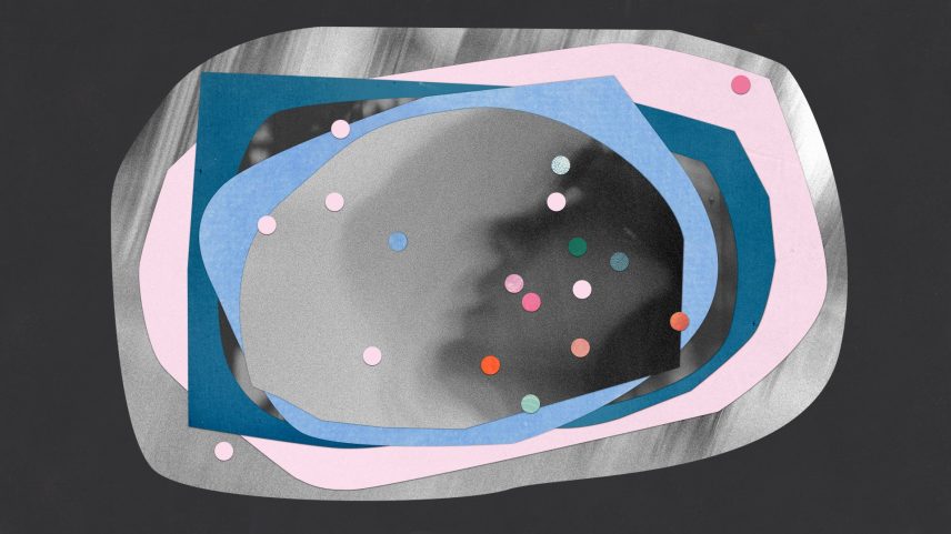 A baby with pink and blue circles.