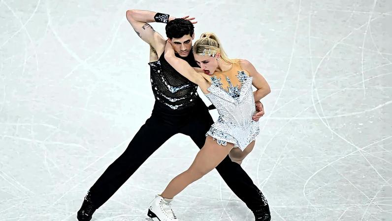 Canada's Piper Gilles and Canada's Paul Poirier compete in the figure skating team event ice dance-rhythm dance during the Milano Cortina 2026 Winter Olympic Games at Milano Ice Skating Arena in Milan on February 9, 2026.