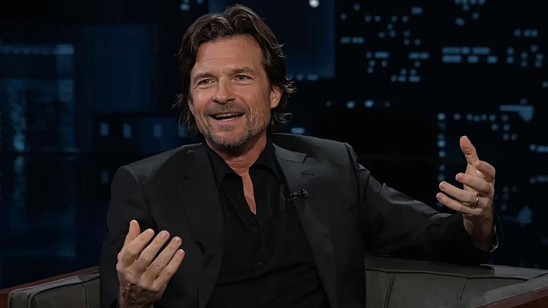 Jason Bateman talking animatedly.
