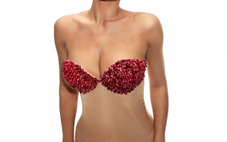 Kylie Jenner took to Instagram wearing nothing but pomegranate seeds for her latest lip butter launch.