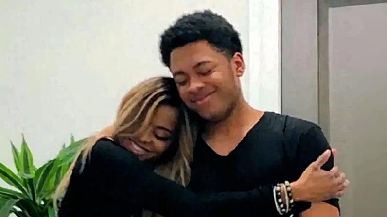 Mary Cosby hugging her son Robert Jr.