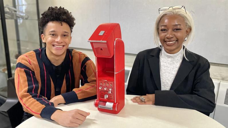 Jacob Payne (left) and Ayah Mahmoud pose with their interactive kitchen assistant, Kitchen Cosmo.