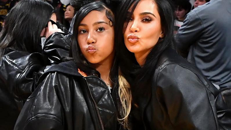 North West with her mom at a Lakers game in 2024.